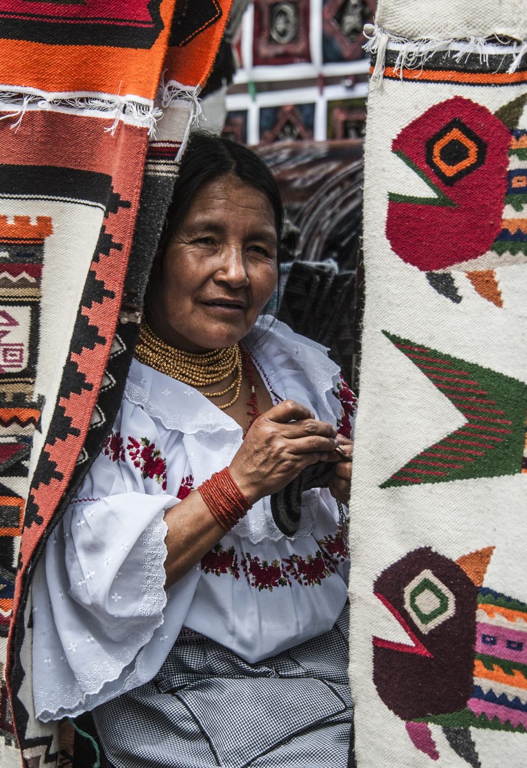 Ecuadorian Indian ethnic women in national clothes at a market