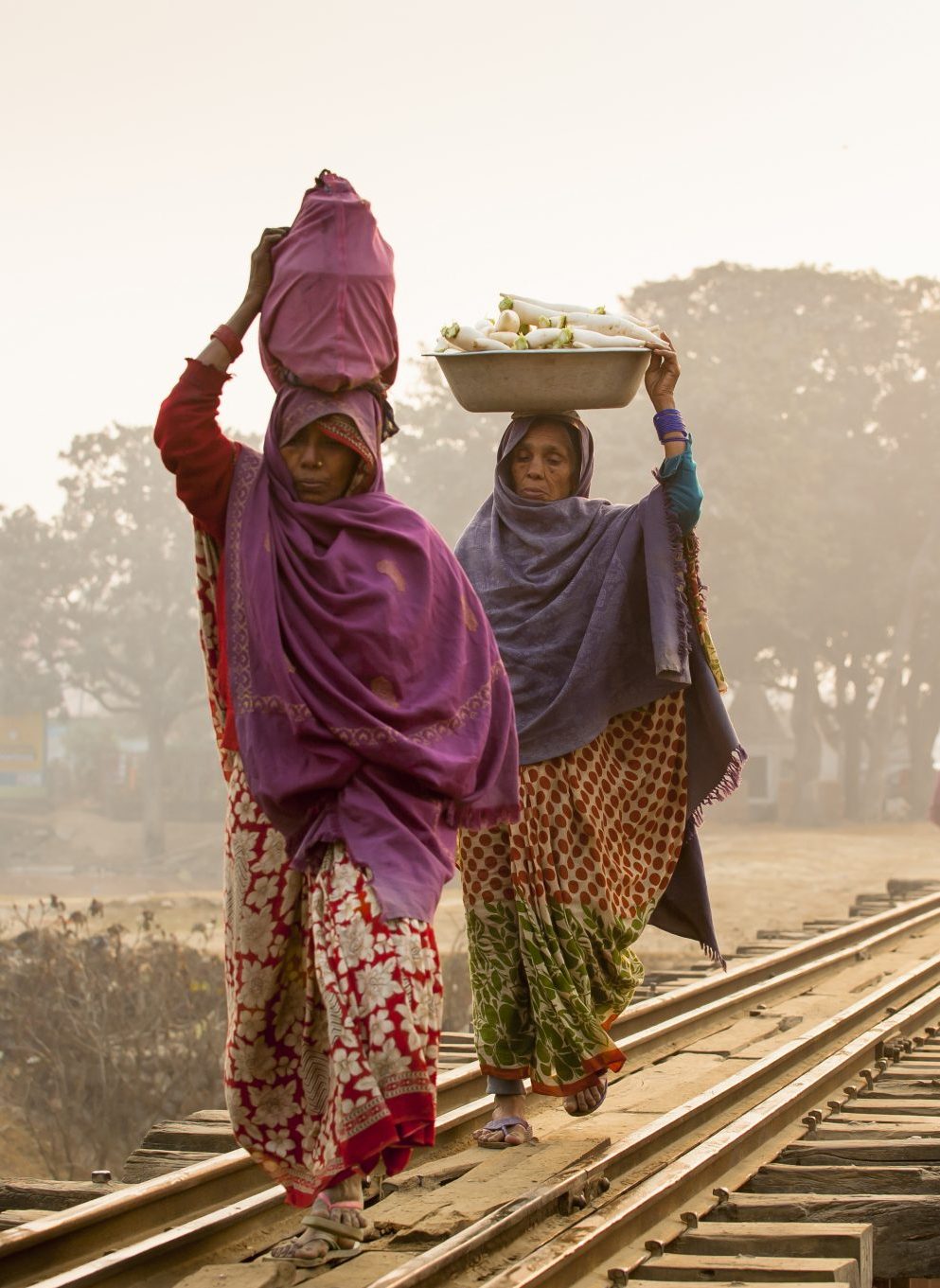 Women carrying items on their heads